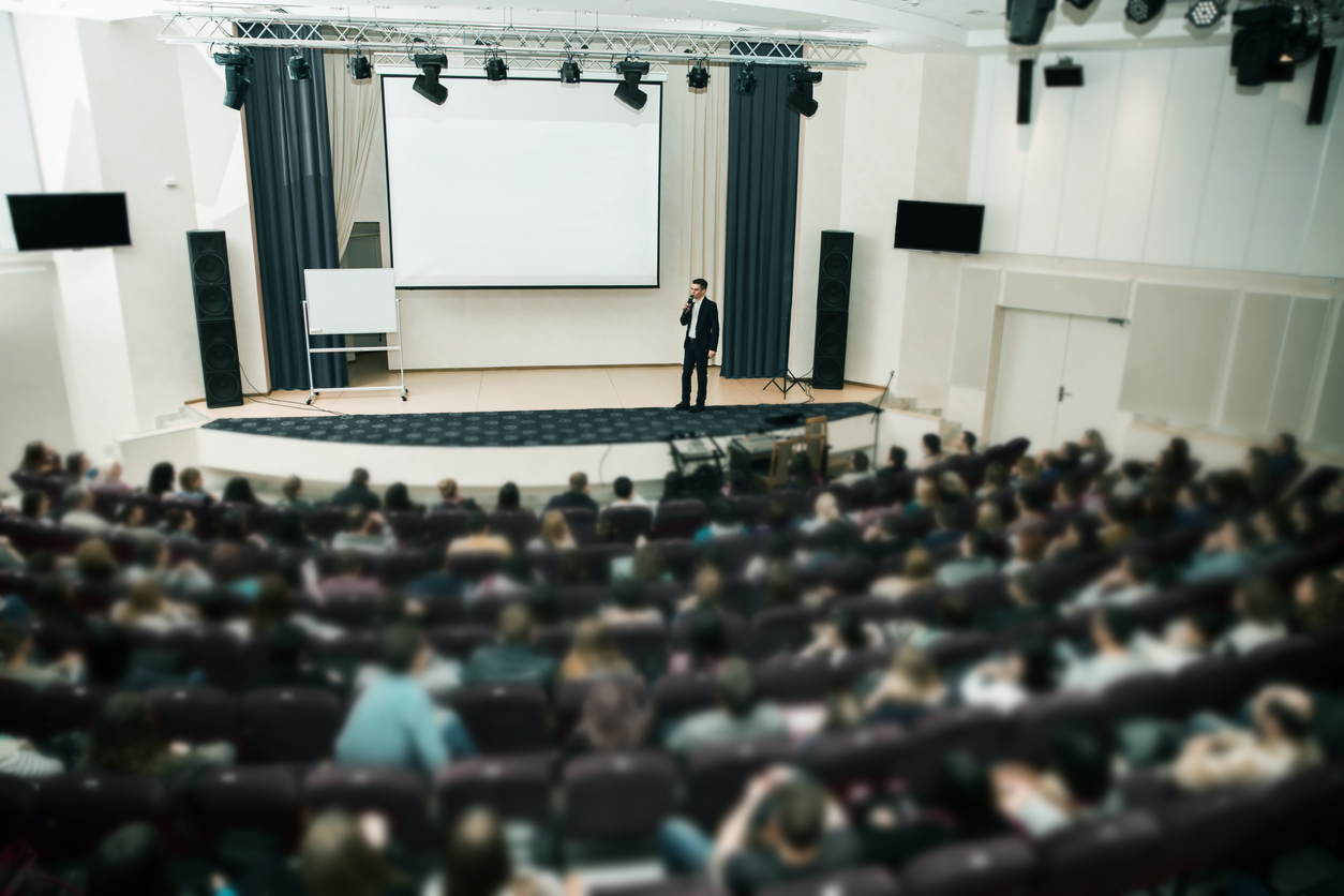Man giving training to a lecture theatre